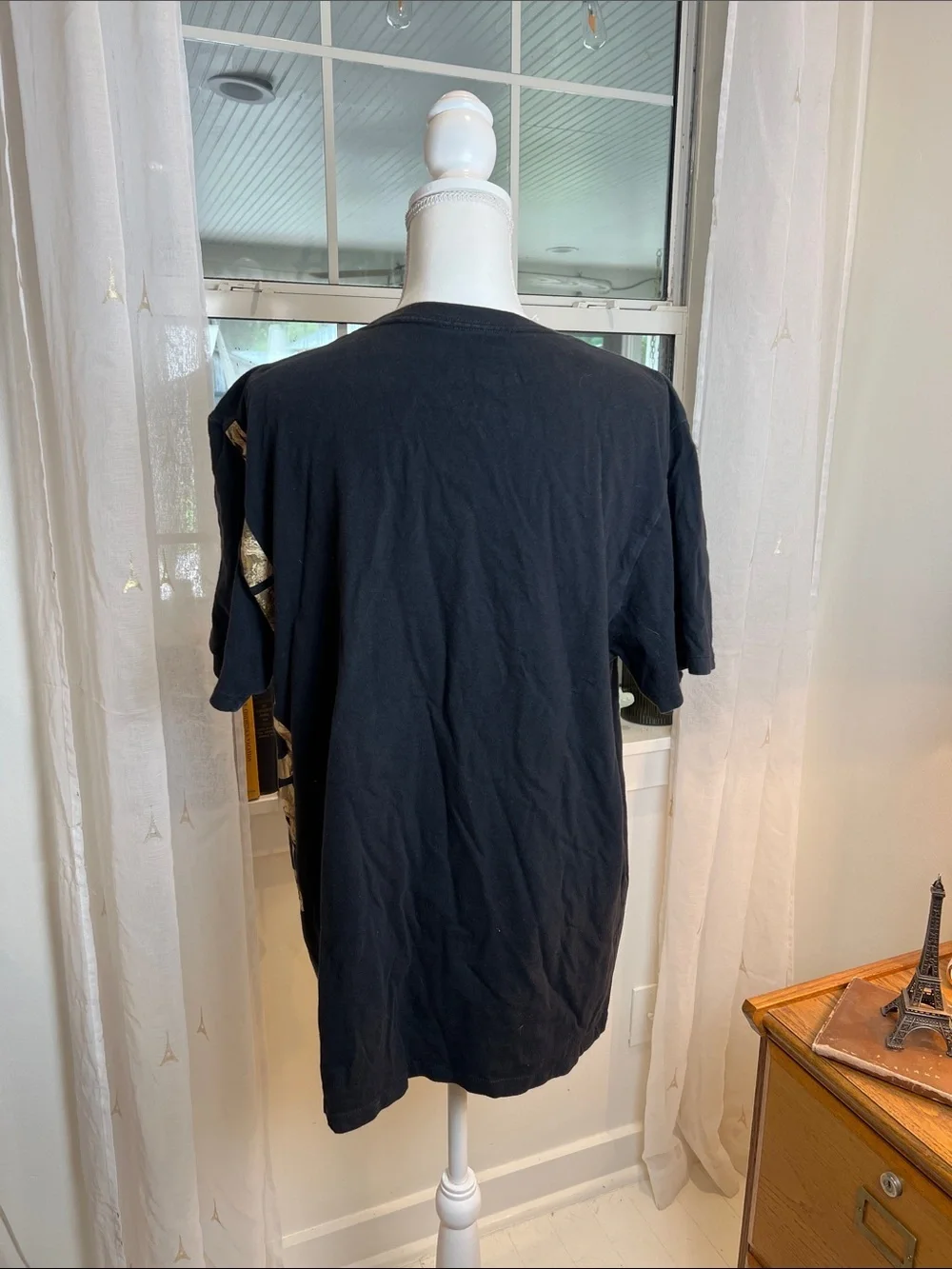 The North Face Black Tee with Gold Side Logo size XL.